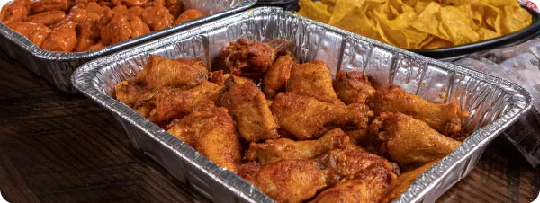 a game day bundle with chafing dishes full of wings
