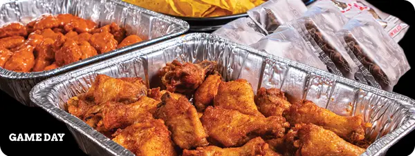 a game day bundle with chafing dishes full of wings
