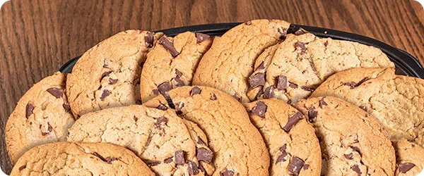 A large plate of chocolate chip cookies