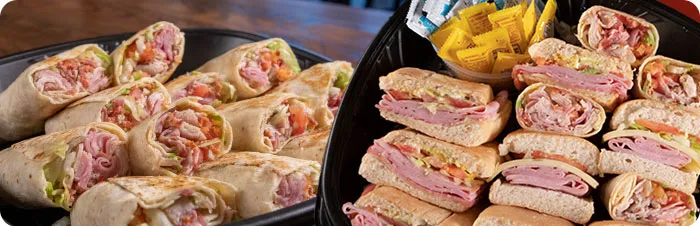 Trays full of club wraps and traditional Tampa Cuban sandwiches