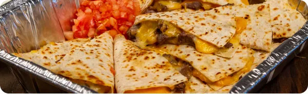 A chafing dish full of quesadillas