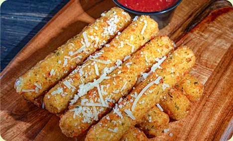 Fried mozzarella cheese sticks with sauce