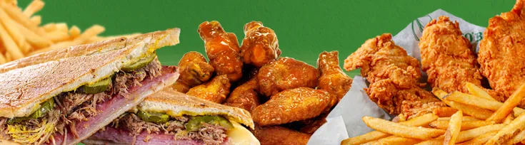 A Cuban sandwich, chicken tenders, wings, and fries